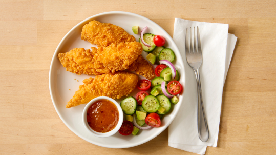 Gluten free chicken tenderloins with sauce and vegetables 
