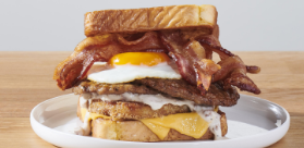 Lumberjack Stack Breakfast Sandwich on a white plate