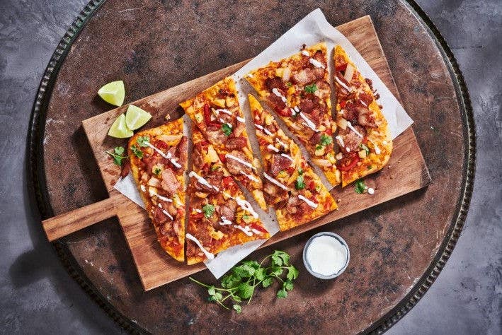 Ham bacon flatbread on a wooden plate image