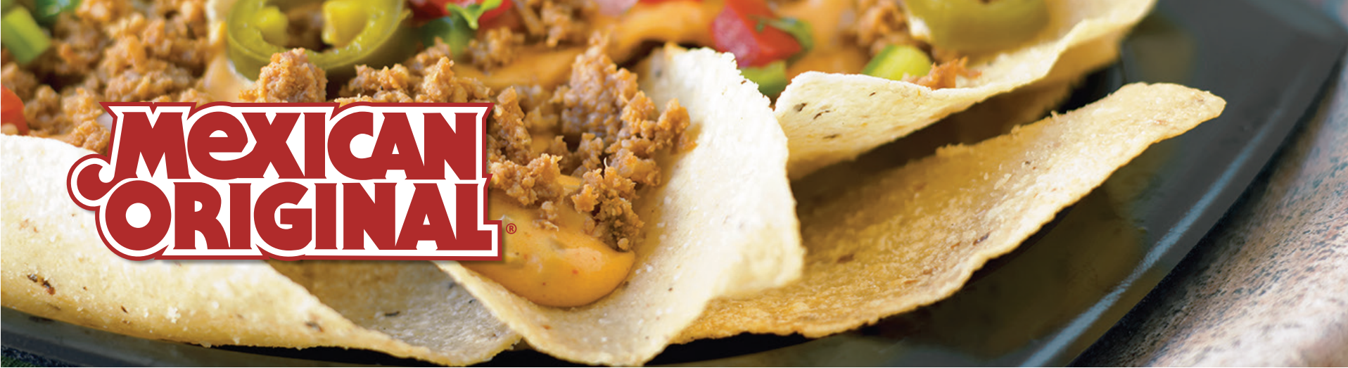 Mexican Original title with beef nachos with jalapenos, tomatoes and cheese 