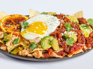 Chilaquiles with chorizo, egg, avocado and cilantro