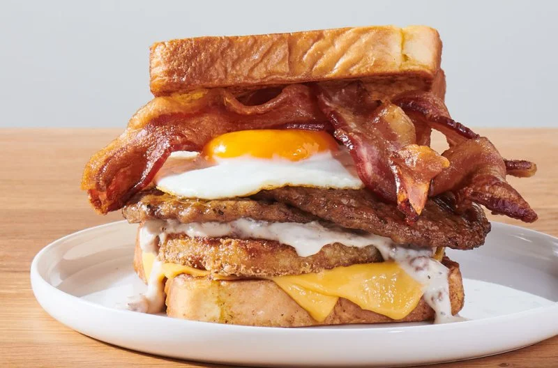 Lumberjack Stack Breakfast Sandwich on a white plate