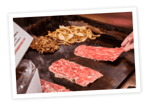 Grill with philly flat steaks and grill onions