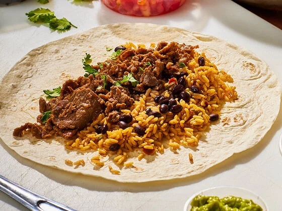 Steak burrito taco with rice and black beans